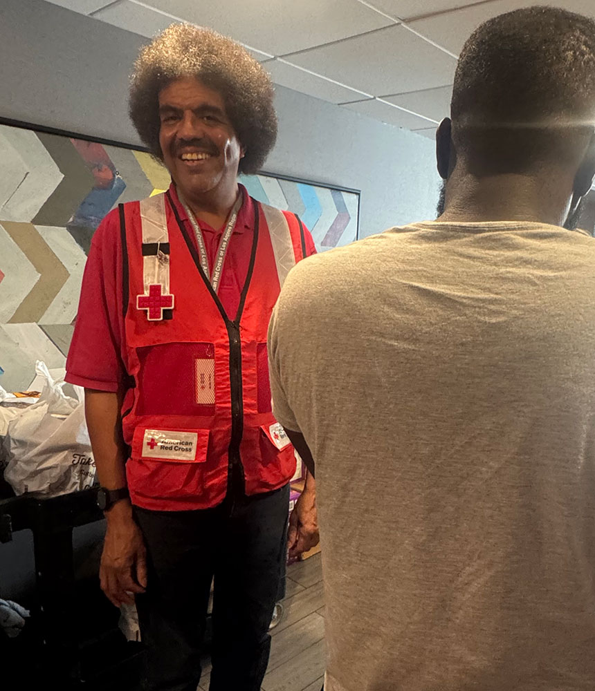 Jerome Thierry wearing a Red Cross vest.