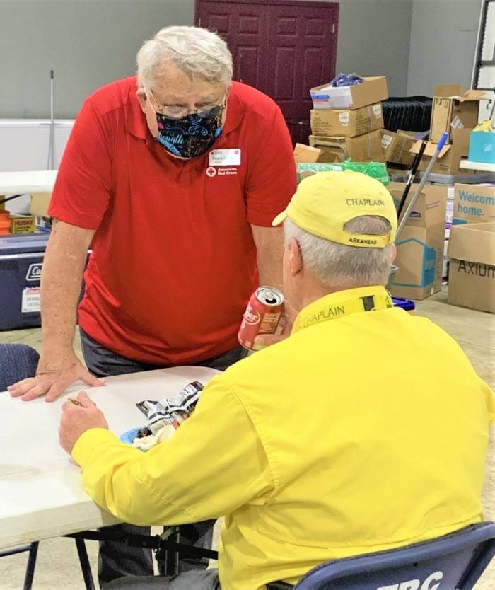Volunteer Boyce Lawson talks to chaplain