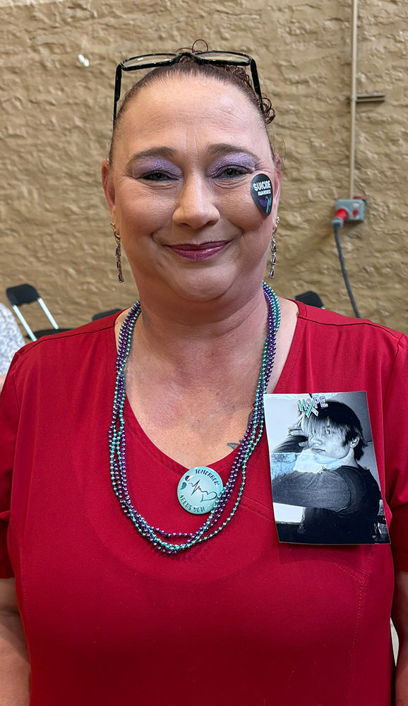 Red Cross phlebotomist Tracy Chestnut wearing a picture of her nephew Doug Jr. on her shirt.