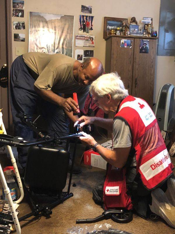 red cross volunteer assisting ricky