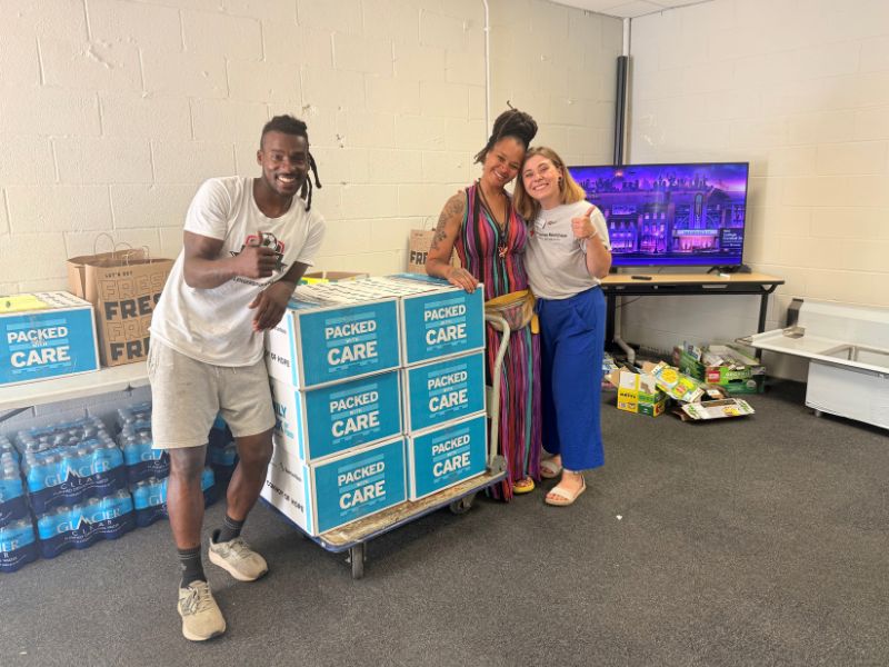 volunteers gathered around loaded boxes
