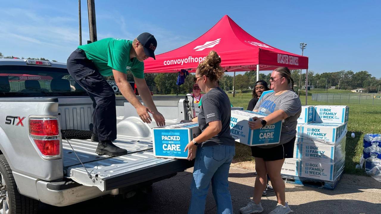 volunteers loading the back of truck