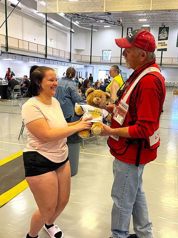 volunteer talking with shelter resident.