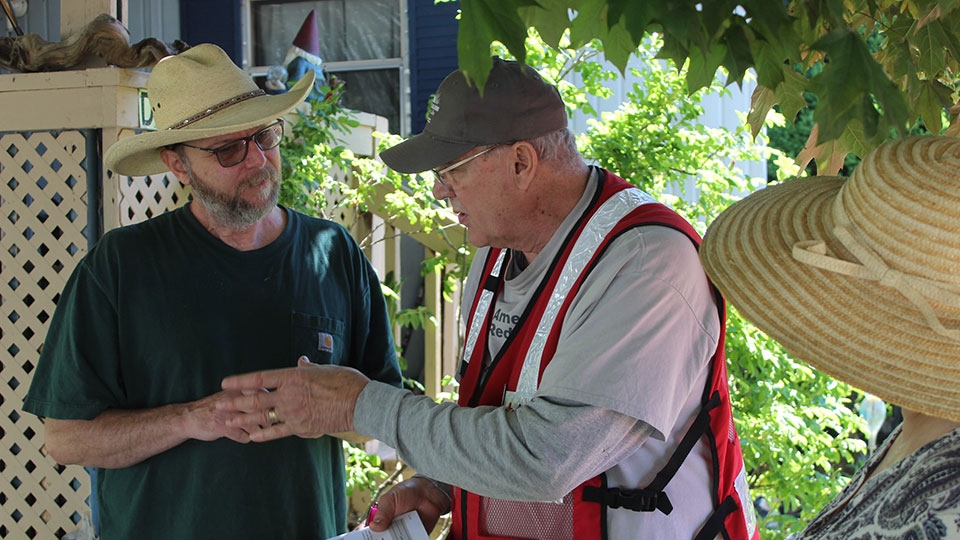 Red Cross volunteer Max Nuxoll helps an Orofino family prepare for the upcoming wildfire season.
