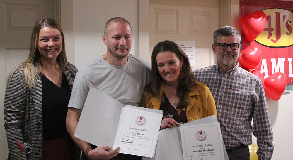 Montana Red Cross Executive Director Hannah Zuraff, left, and Board Chair Craig Stahlberg, right, present Red Cross Lifesaving Awards to Troy Rogge and Jennifer Hardwick.
