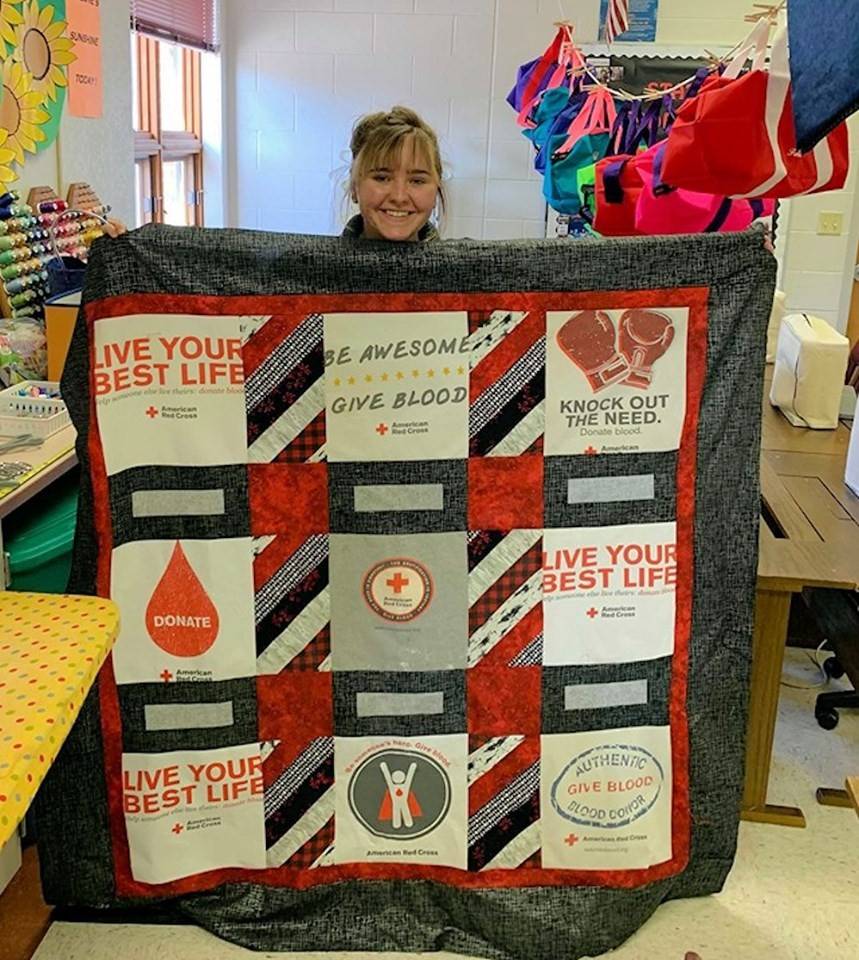 Woman creates quilt out of Red Cross shirts after donating blood