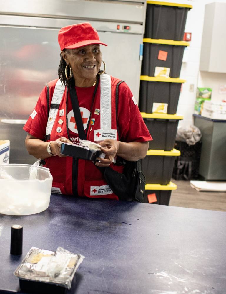 Red Cross volunteer Essie Hopkins serves meals at a shelter in Florida after Hurricane Milton in 2024.