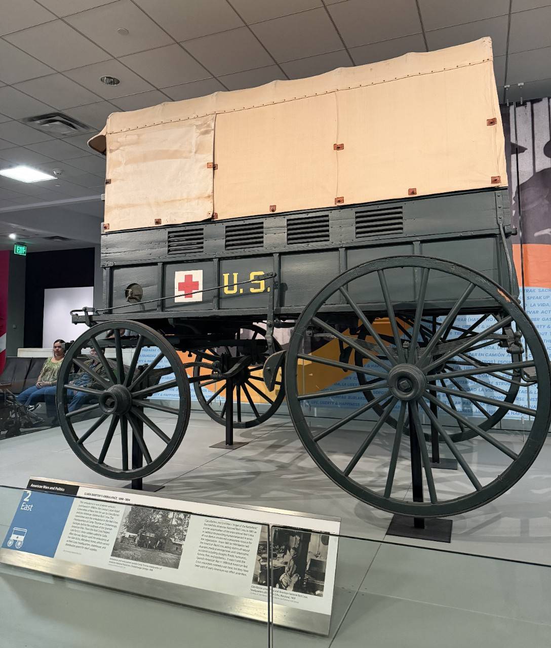 Photograph of Clara Barton's ambulance, a covered wagon from the 1800s, on display at the Smithsonian