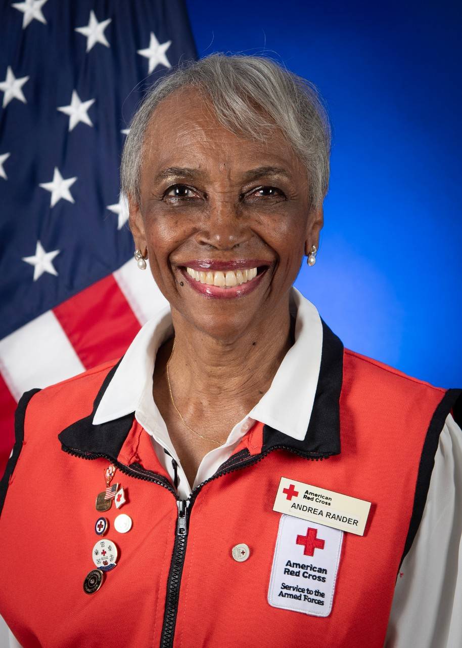 Photograph of Andrea Rander wearing a Red Cross vest