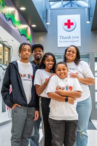 David Dandridge Jr. and his wife, Oni, are pictured with their children, David III, Donovan and Skylar, at the Sickle Cell blood drive at the Red Cross’s Baltimore office on Sept. 6, 2025. All three children live with sickle cell disease, and David Jr. also has the disease - his life sustained by blood transfusions. Oni carries the sickle cell trait. For the Dandridge family, blood donations are a lifeline that help keep them healthy and together. Photo by: Scott Marder/American Red Cross.