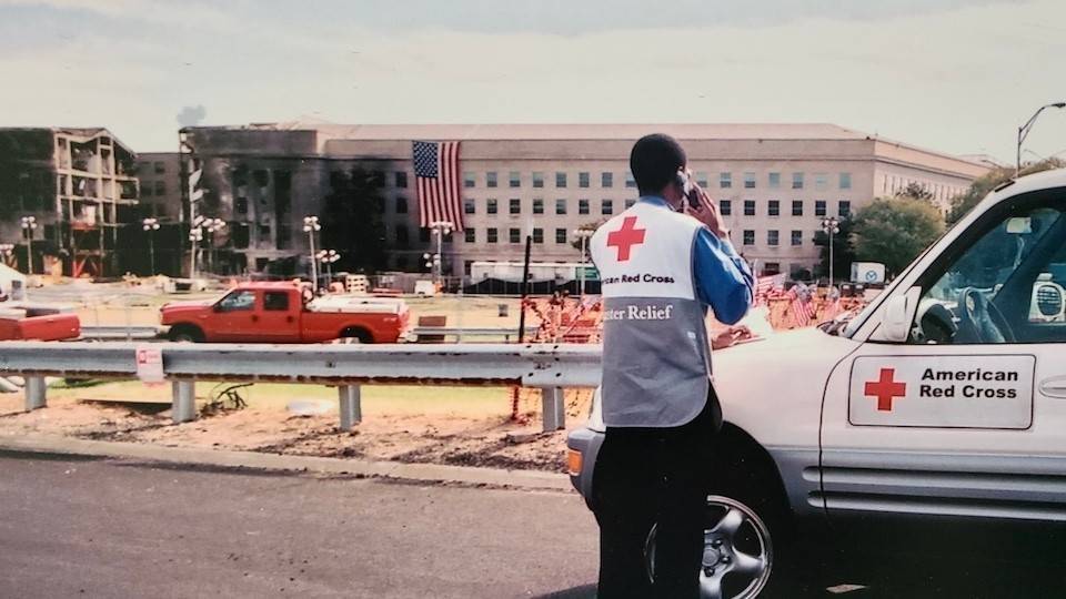 A volunteer stands in front of the Pentagon after 9/11