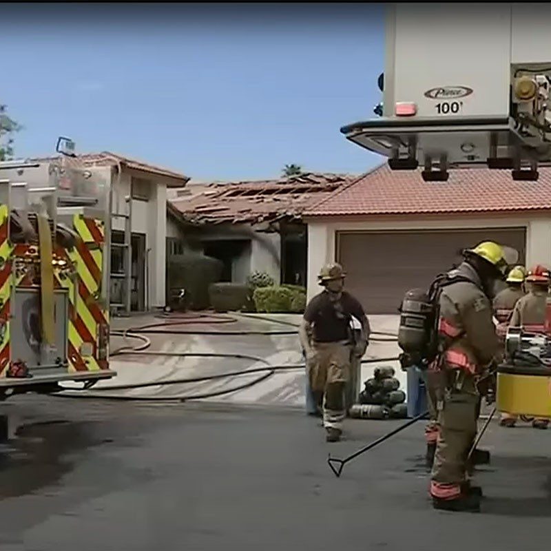 Fireman next to house that was on fire