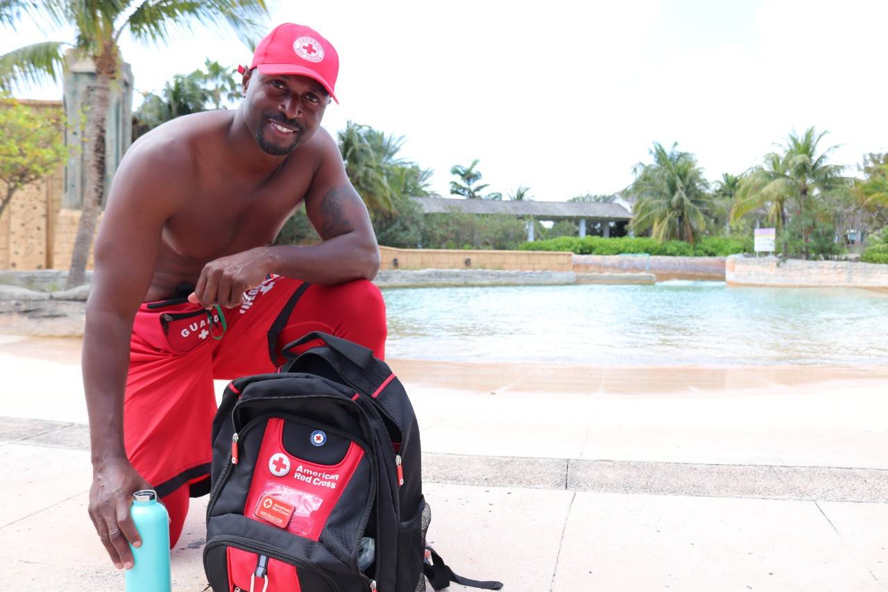 February 18, 2021. Atlantis Aquaventure waterpark, Nassau, Bahamas. The Bahamas Red Cross has officially added “Lifeguard Certification and Instructor Training” to its repertoire of lifesaving skills courses. Supported and funded by the American Red Cross, the Bahamas Red Cross trained a class of instructors of the new lifeguarding course which will be offered throughout the Bahamas. Around a dozen people made up the first class coming from New Providence, Abaco, Exuma and Grand Bahama.

The new course is a collaboration between the Bahamas Red Cross and American Red Cross which has set up a delegation in the Bahamas to support long-term recovery work following Hurricane Dorian. This new program is just one of many new additions to the wide-reaching work of the Red Cross to help people affected by Hurricane Dorian and improve the lives of the Bahamian community as a whole.

Brian Miller was one of the first to take the new Lifeguard courses and the training takes participants from the classroom, to the pool, the beach and even a waterpark for a full experience of possible scenarios. Photo by Holly Baker/American Red Cross

