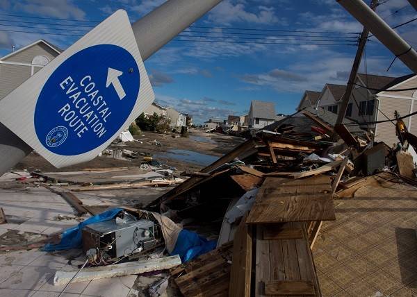 Superstorm Sandy 2012

Entire neighborhoods have been rearranged by hurricane-force winds and waves. One-story bungalows, lifted off their sand foundations, came to rest a full block from where they were built, while more recent two-and three-story homes are now see-through structures, their contents – furniture, appliances, even wallboard and flooring – hauntingly absent. Photo by Les Stone/American Red Cross