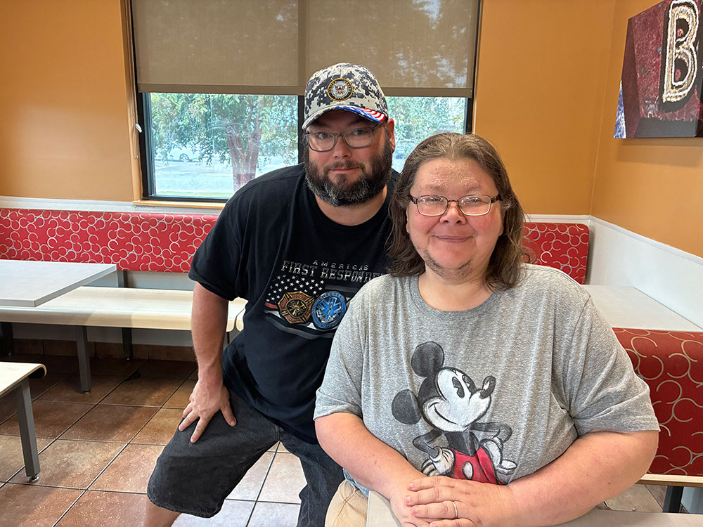 Jackie Wilkes and another person sitting in a restaurant.