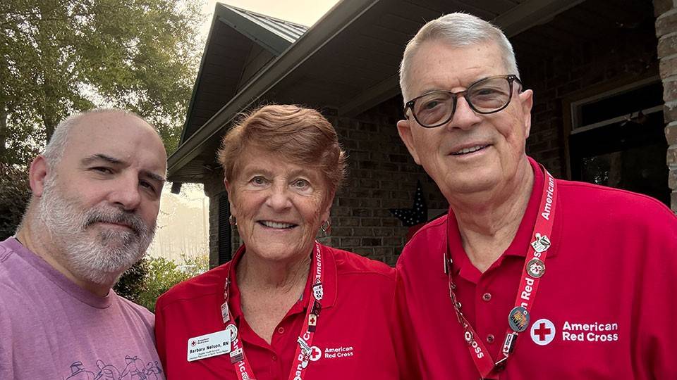 Group pic of Red Cross volunteers Barbara and Rick Nelson and their son-in-law.
