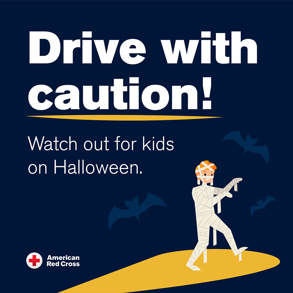 Drive with caution banner with drawing of a mummy and the Red Cross logo.