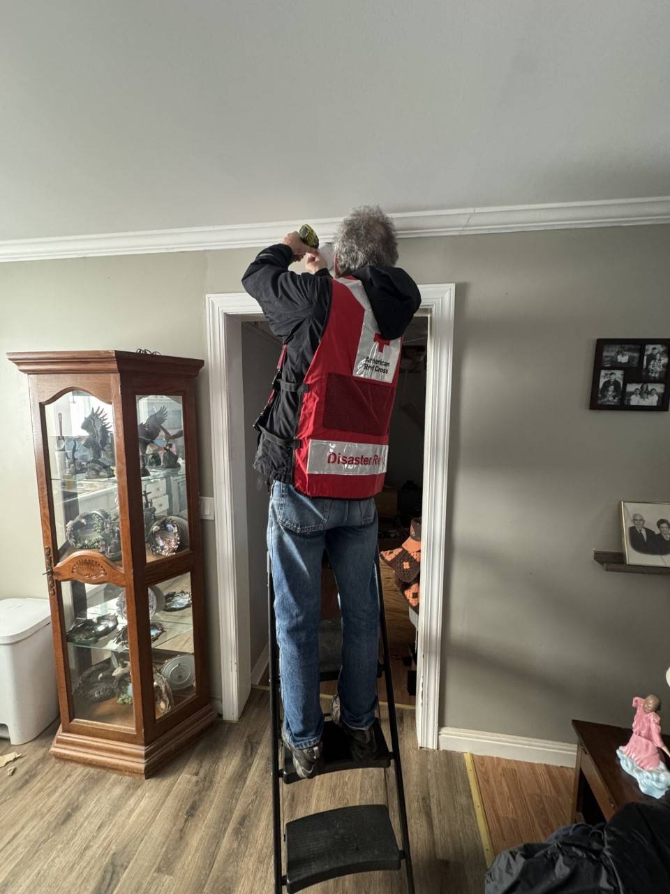 Greg Grodem installs a fire alarm
