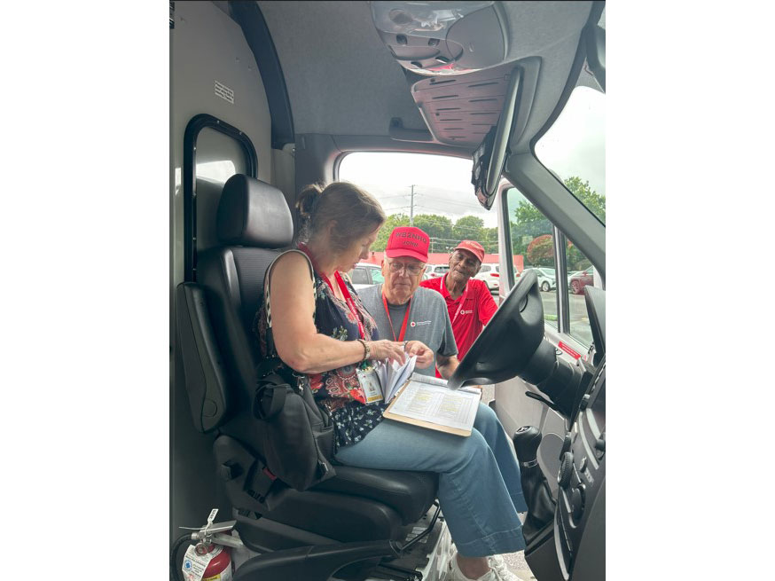 Johnny Anderson and red cross volunteer doing emergency response vehicle training.