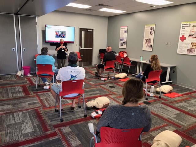 Marsha teaching a class with students