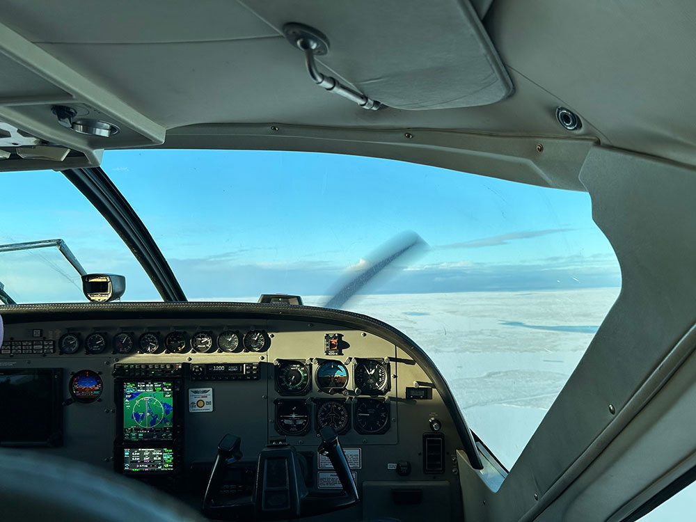 Inside the cockpit of an airplane while it's flying.