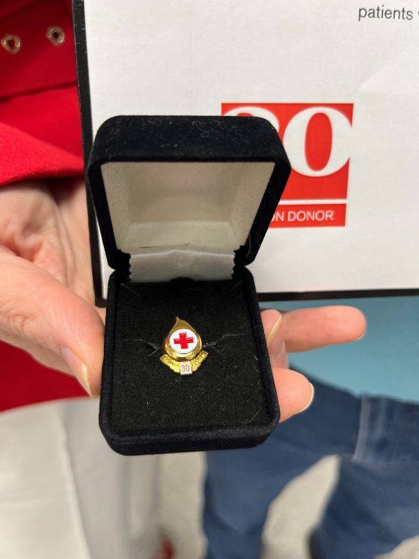 close-up of red cross pin