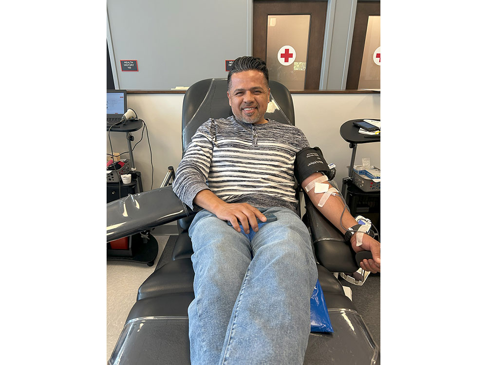 Photo of Omar Rodriguez donating blood.