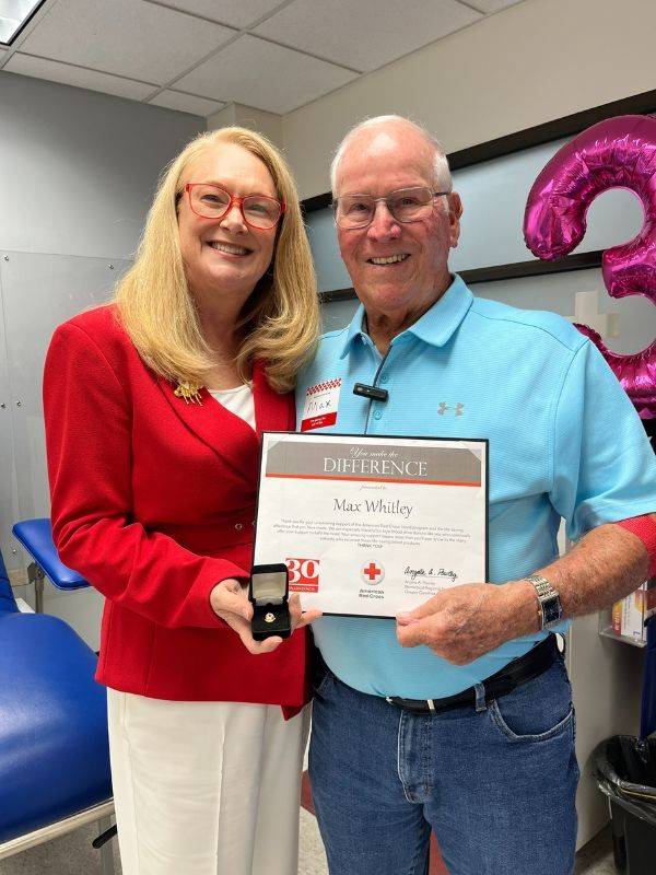 max receiving red cross pin and certificate
