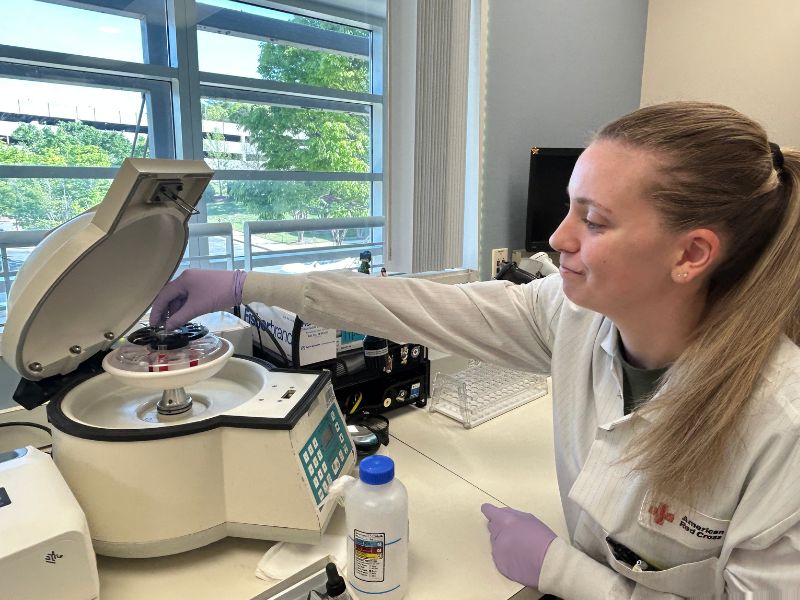 sara placher handling lab equipment