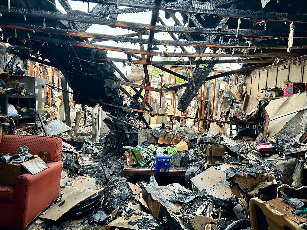 Inside burned home with debris scattered all over the place.