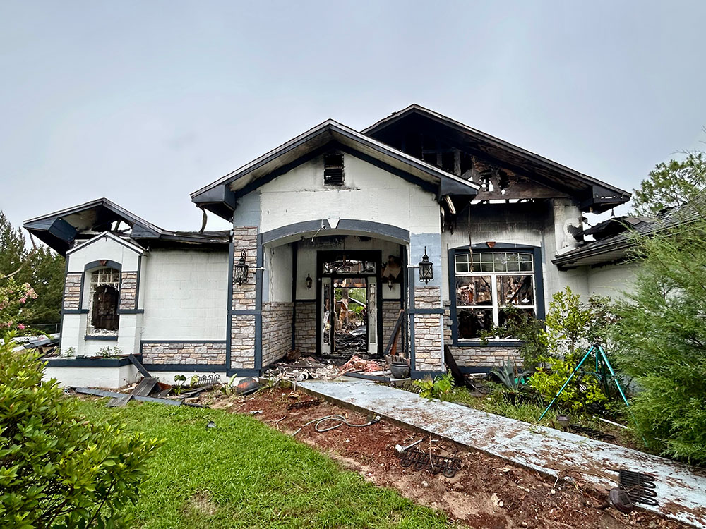 front of house that has been burned.