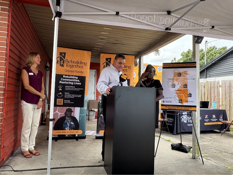 two people at podium