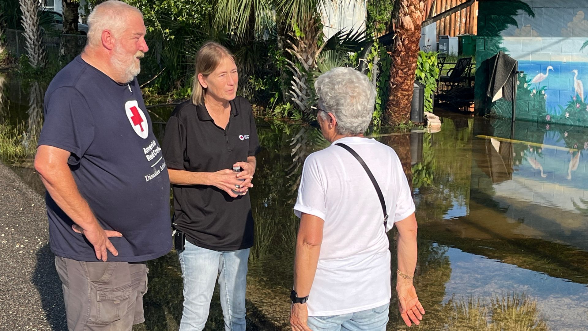 volunteers speaking to each other outside.