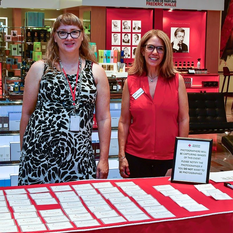 Two Red Cross volunteers at the 8th annual American Red Cross Executive Breakfast