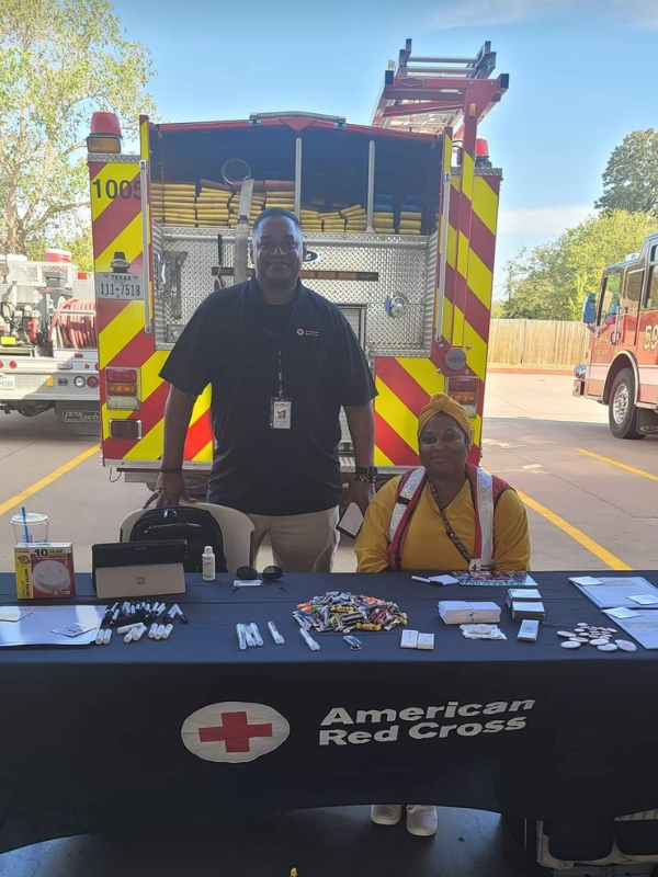 michael barber and volunteer at red cross stand