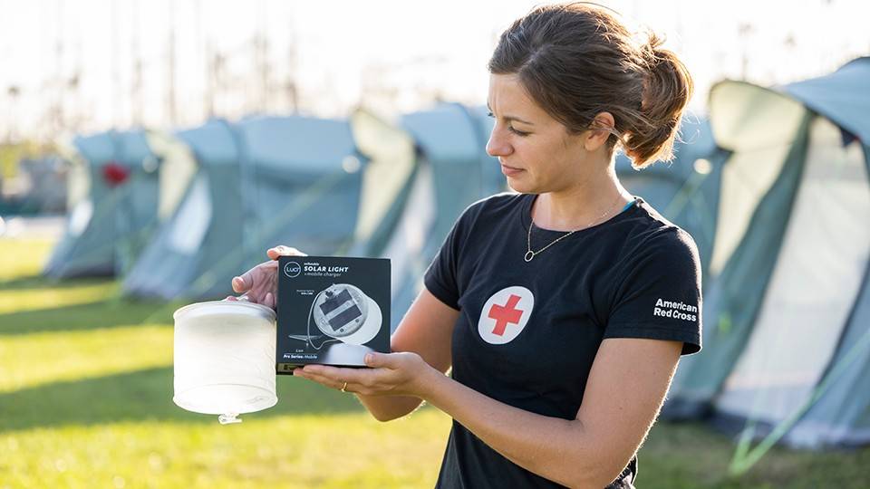 November 21, 2019. Abaco, Bahamas. With generators scarce in some neighborhoods, many families still do not have electricity. Racing the sun to complete errands, household tasks and homework can be a challenge. That burden is being lifted as the Red Cross distributes solar powered lights, like the ones from MPOWERD, across the Abaco Islands. Photo by Brad Zerivitz/American Red Cross