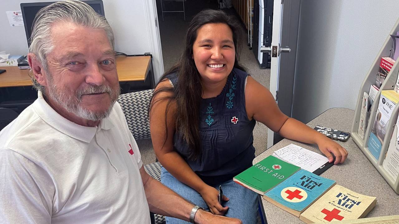 Joseph Misek, a 52 year Red Cross volunteer interviews with Eli Hernandez, a new Red Cross intern.