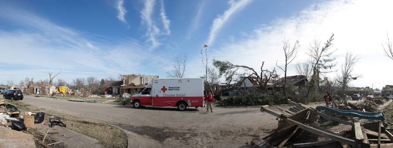 December 31, 2015 -- Garland, Texas --  ERV crew Santana Garcia and Idalia Treviño (who are married) hand out supplies in an badly damaged area of Garland.  The couple lives in Harlingen, Texas where they are members of the South Texas Chapter of the ARC. Photos by Dennis Drenner for the American Red Cross.