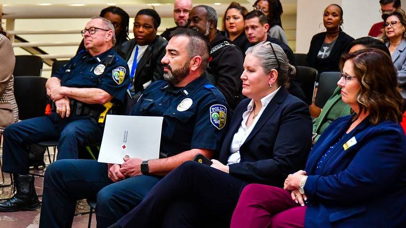 DART Police Officer Lee Cannon surrounded by his peers after receiving the American Red Cross Lifesaving Award.