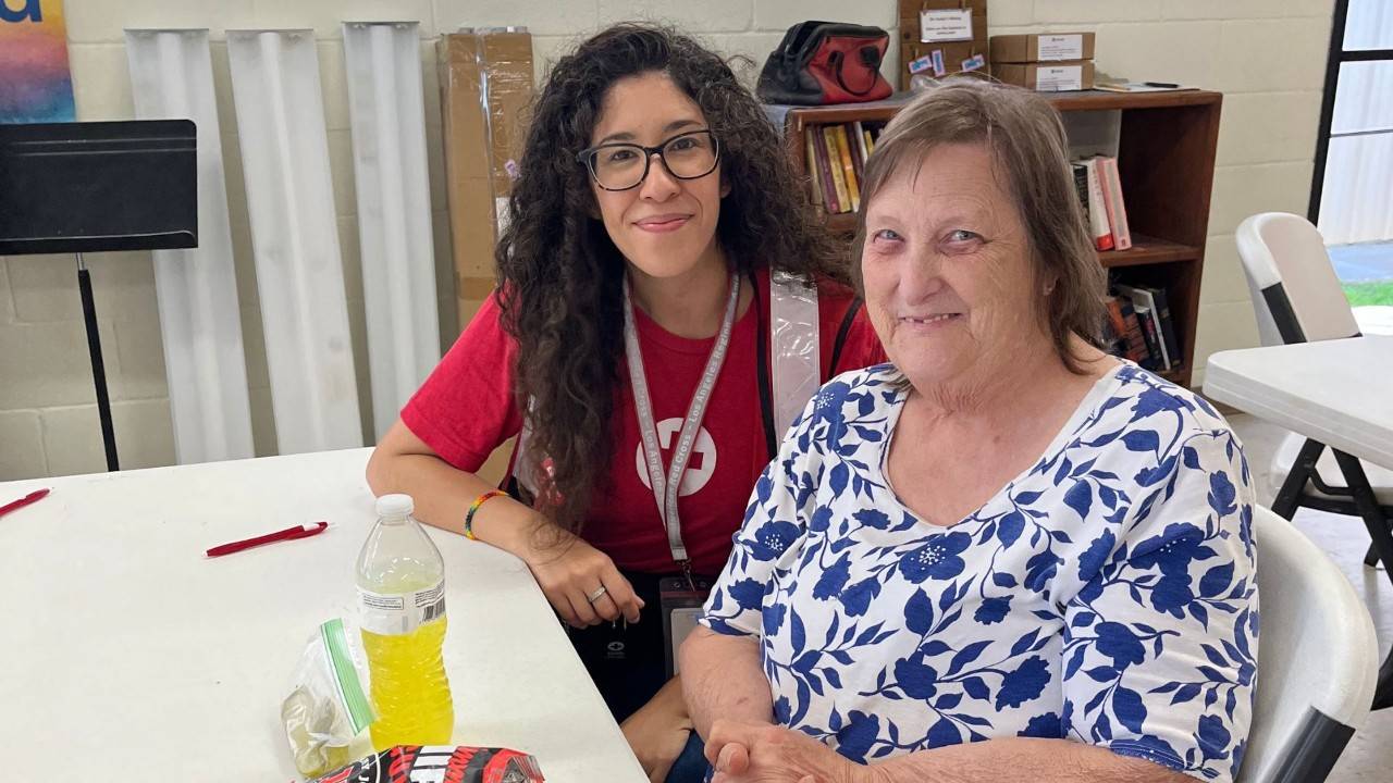 volunteer and woman in shelter