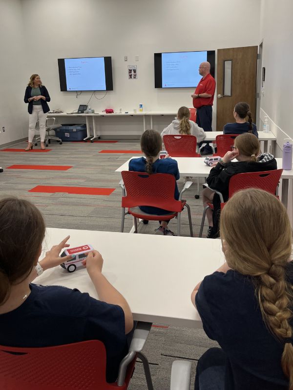 students listening to instructor