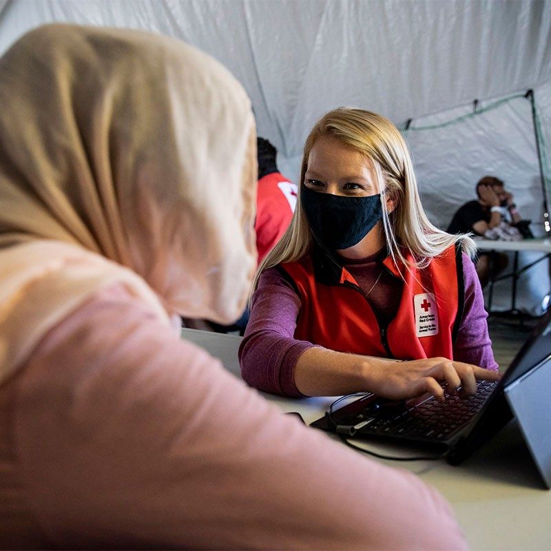 Red Cross volunteer Ola Alani helping others.