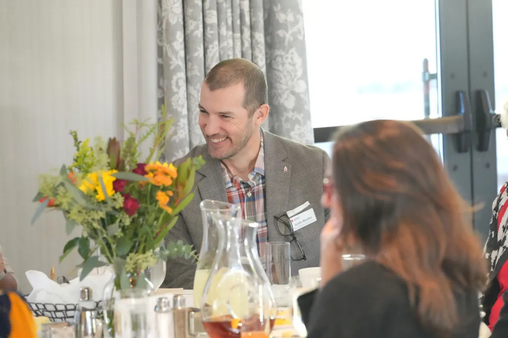 justin at a banquet dinner table