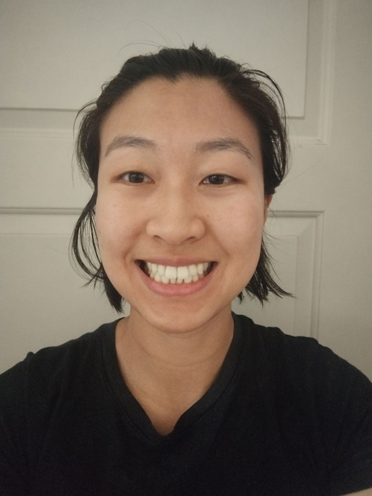 Aerial Chen smiling while taking a selfie.