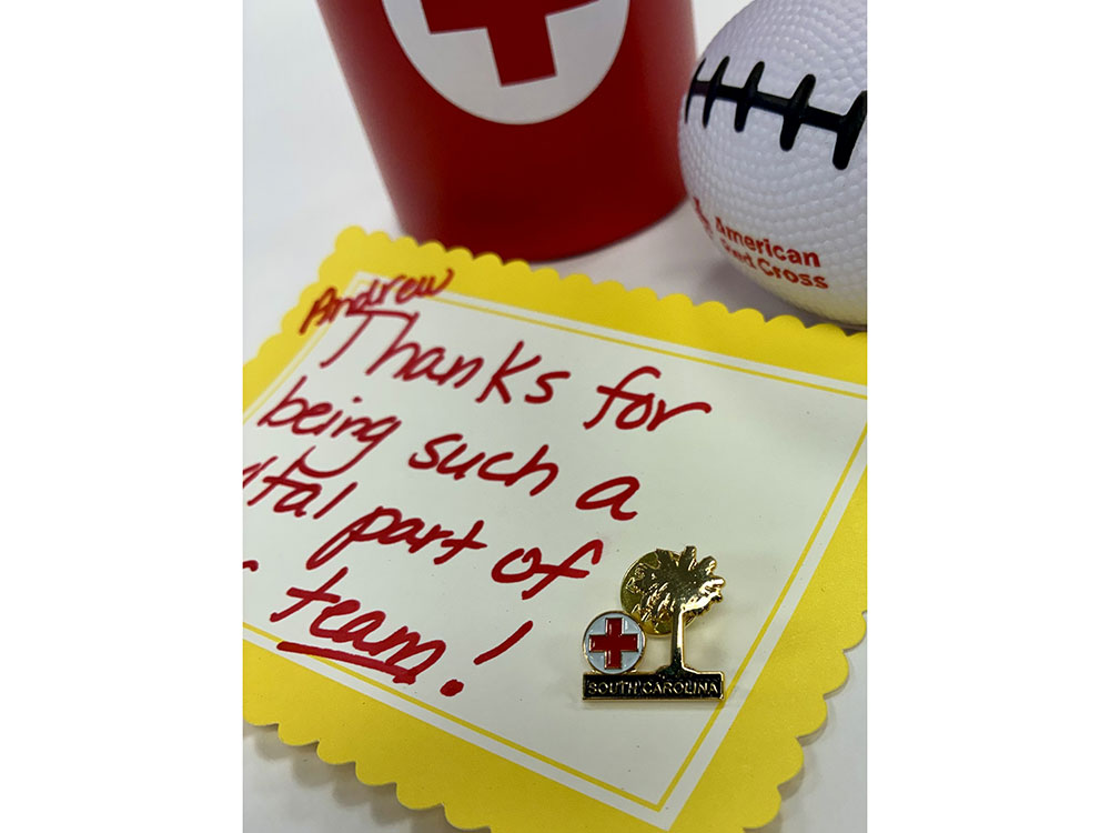 A thank you note and Red Cross pin from the Red Cross to Andrew.