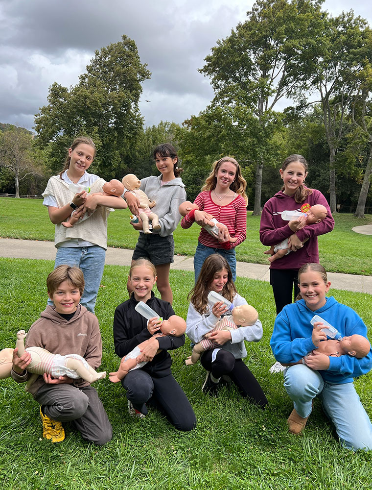Berkeley Rahn, Paula Luzardo, Natalie Malas, Eloise Green, Trey Roost, Piper Hanson, Simone Gendreau and Molly Foster hold mannequin babies during Red Cross Babysitter’s Training course at Marinwood Community Center in San Rafael, Calif.