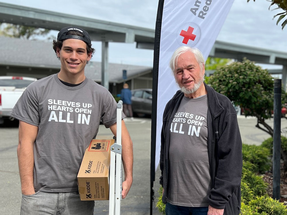 Red Cross volunteers Brayden and John Hulls ready to install free smoke alarms.