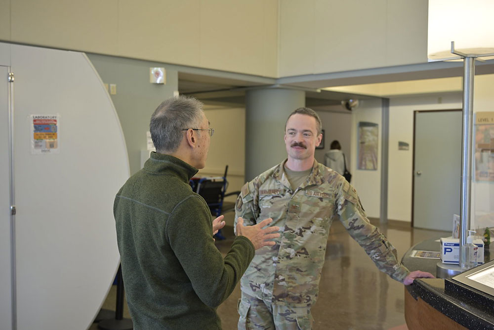Col. Alexei Kambalov and Red Cross volunteer Danilo Canlas, MD speaking to each other at the David Grant Medical Center at Travis Air Force Base. 