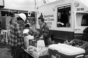 A Red Cross worker provides meals to people after the Loma Prieta earthquake