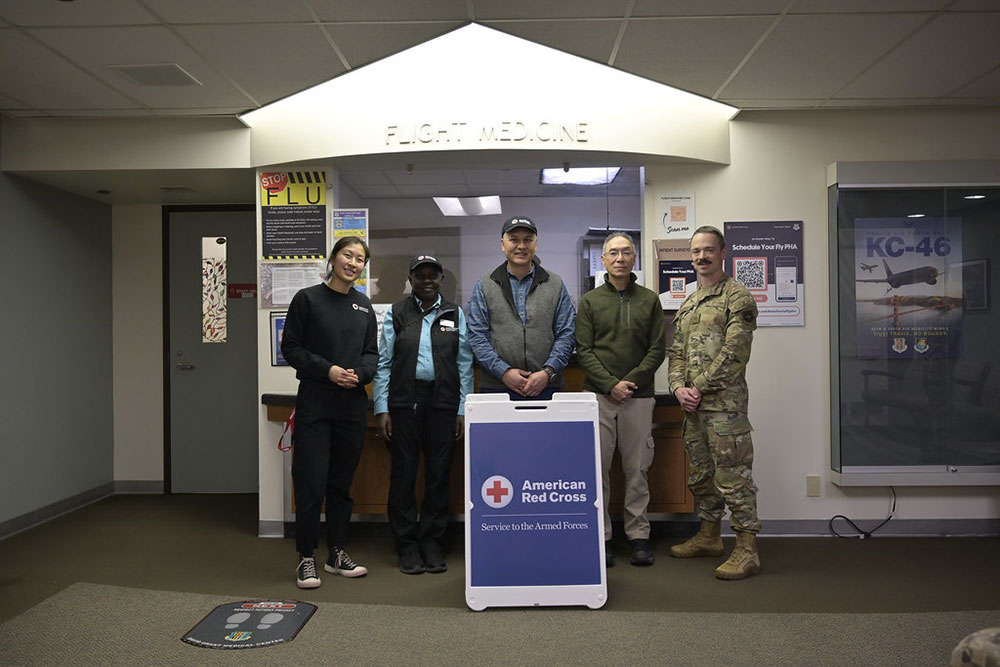 Red Crossers Aerial Chen, Alzinia Pailin, Dr. Justin Nast, Dr. Dan Canlas, with Col Alexei Kambalov at the flight medicine clinic at David Grant Medical Center at Travis Air Force Base.